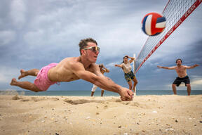 Friends Play Beach Volleyball On Hot Melbourne Day