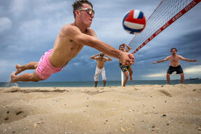 Friends Play Beach Volleyball On Hot Melbourne Day