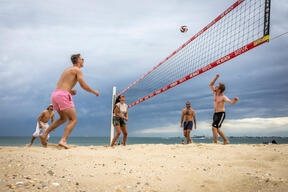 Friends Play Beach Volleyball On Hot Melbourne Day