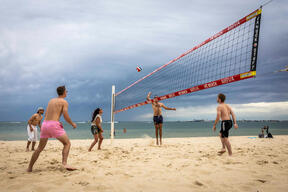 Friends Play Beach Volleyball On Hot Melbourne Day