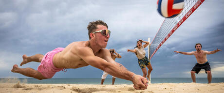 Friends Play Beach Volleyball On Hot Melbourne Day