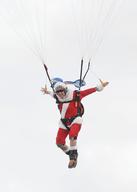 Skydiving Santas Deliver Christmas Gifts
